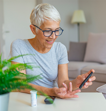 woman checking her blood sugar
